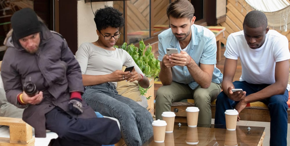 air head nation staring at phones coffee